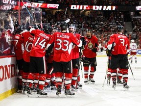 Ottawa Senators players celebrate their overtime win over the New York Rangers on May 6.