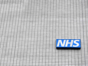 An NHS (National Health Service) sign pictured outside St. Thomas' Hospital in central London. Several British hospitals were hit by a cyber attack on May 12, 2017, forcing some patients to cancel routine appointments.