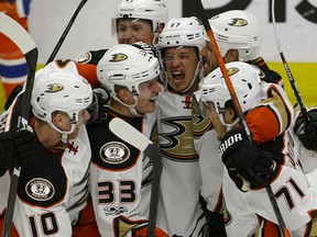 The Anaheim Ducks celebrate after Jakob Silfverberg (33) scored in overtime to beat the Edmonton Oilers 4-3 in Game 4 of their second-round NHL playoff series at Rogers Place in Edmonton on Wednesday night. The series is now tied 2-2.