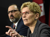 Ontario Premier Kathleen Wynne, right, speaks as Ontario Energy Minister Glenn Thibeault looks on during a press conference in Toronto on March 2, 2017.