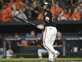 Catcher Welington Castillo of the Baltimore Orioles watches the flight of his walk-off, 10th inning homerun against the Toronto Blue Jays during MLB action Friday night in Baltimore. Castillo had a pair of homers on the night as the Orioles prevailed, 5-3.