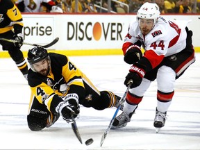 Ottawa Senators forward Jean-Gabriel Pageau (right) reaches for the puck against Pittsburgh Penguins defenceman Justin Schultz on May 13.