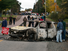 RCMP vehicles destroyed by anti-fracking protesters in Rexton, New Brunswick, near the Elsipogtog First Nation.