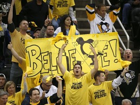 Pittsburgh Penguins fans cheer during overtime of Game 7 of the Eastern Conference final between the Penguins and the Ottawa Senators on Thursday, May 25, 2017.