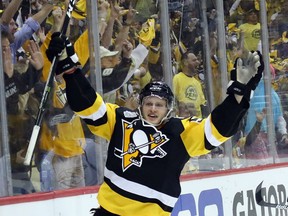 Jake Guentzel of the Pittsburgh Penguins celebrates his game-winning goal in Game 1 of the Stanley Cup Final Monday night in Pittsburgh. The goal gave the Pens a 4-3 edge late in the third period, and they would add an empty-net goal to win 5-3 and draw first blood in the best-of-seven series. Game 2 is Wednesday in Pittsburgh.