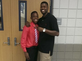 This undated family photo provided by Edwards family attorney Lee Merritt shows Jordan Edwards, left, posing for a photo with his father, Odell Edwards. The family of the black teenager shot and killed by a white police officer while riding in a vehicle leaving a party wants criminal charges filed against the officer, who was fired for violating department policies during the shooting. Balch Springs police Officer Roy Oliver was fired three days after 15-year-old Jordan Edwards' death.