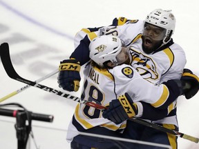 James Neal, left, is congratulated by P.K. Subban after scoring the game-winning goal in  overtime for the Nashville Predators against the Anaheim Ducks in Game 1 of the Western Conference Final Friday in Anaheim. Neal's goal gave the Preds a 3-2 victory. Game 2 is Sunday night in Anaheim.