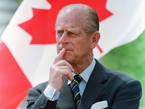 Prince Philip, the Duke of Edinburgh, listens to a speech while visiting the University of Sherbrooke on May 20, 1989.