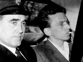 Ian Brady, right, is escorted in October 1965 as he arrives at the courthouse in Hyde, Cheshire, England, to be convicted of the Moors murders of five children together with accomplice Myra Hindley in the Greater Manchester area of England.