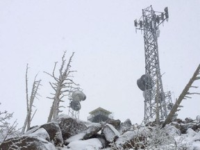 A snow covered forest service lookout tower on Mt. Elden overlooking Flagstaff, Ariz. where a man had to be treated for hypothermia and rescued.