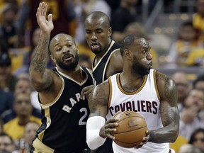 In this May 3 file photo, Toronto Raptors forwards P.J. Tucker (left) and Serge Ibaka defend against Cleveland Cavaliers forward LeBron James.