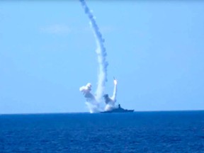 Long-range Kalibr cruise missiles are launched by a Russian Navy ship in the eastern Mediterranean in this image provided by the Russian Defence Ministry.