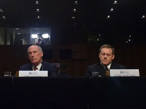 Director of National Intelligence Daniel Coats, left, and National Security Agency Director Adm. Michael Rogers prepare to testify before the Senate Intelligence Committee on May 11.