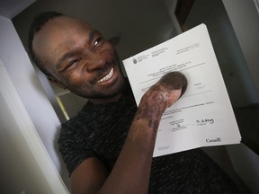 Seidu Mohammed walked across the United States border into Manitoba and lost all his fingers to frostbite, but now he has won the right to stay in Canada.