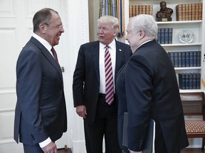 U.S. President Donald Trump meets with Russian Foreign Minister Sergei Lavrov, left, next to Russian Ambassador to the U.S. Sergey Kislyak at the White House in Washington, Wednesday, May 10, 2017.