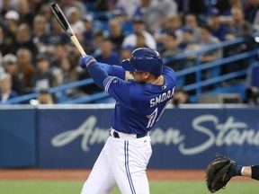 Justin Smoak of the Toronto Blue Jays lets loose with an RBI single during MLB action Thursday against the Seattle Mariners at the Rogers Centre. Smoak had four RBI including a solo homer as the Jays posted a 7-2 victory.