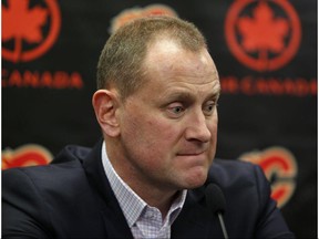 Calgary Flames GM Brad Treliving speaks with reporters at the Scotiabank Saddledome in Calgary on April 21.