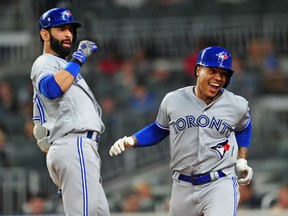 Jose Bautista, left, congratulates winning pitcher Marcus Stroman on his first career homerun in the fourth inning of Thursday's 9-0 Jays victory over the Atlanta Braves at SunTrust Park in Atlanta. Stroman went 5.2 innings to record the win and end Toronto's three-game losing streak.