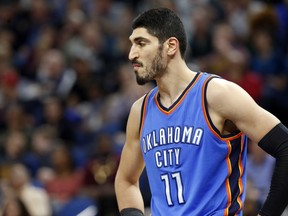 In this April 11 file photo, Oklahoma City Thunder centre Enes Kanter, of Turkey, looks on during a break against the Minnesota Timberwolves.