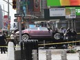 In this Thursday, May 18, 2017 file photo, a car rests on a security barrier in New York's Times Square after driving through a crowd of pedestrians, injuring at least a dozen people. A three-foot-tall piece of stainless steel in the ground ultimately stopped a speeding Honda Accord as it barreled down the crowded sidewalks of Times Square this week. In the wake of the rampage, some New Yorkers are calling for the installation of more protective bollards at the ends of city sidewalks to prevent similar incidents.