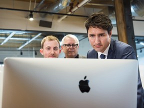 Prime Minister Justin Trudeau, right, and MP Adam Vaughan, centre.