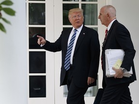 President Donald Trump walks with aide Keith Schiller to the Oval Office of the White House in Washington, Tuesday, May 2, 2017.