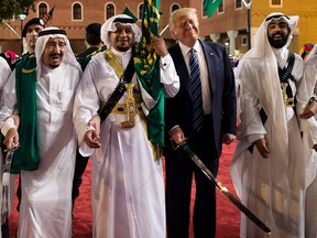 President Donald Trump and Saudi Arabia's King Salman bin Abdulaziz al-Saud (left) dancing with swords at a welcome ceremony ahead of a banquet at the Murabba Palace in Riyadh.