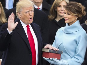 Donald Trump is sworn in as the 45th president of the United States as Melania Trump looks on during the 58th Presidential Inauguration at the U.S. Capitol in Washington on Jan. 20, 2017.