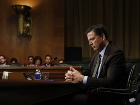 In this Wednesday, May 3, 2017, photo then-FBI Director James Comey pauses as he testifies on Capitol Hill in Washington, before a Senate Judiciary Committee hearing.