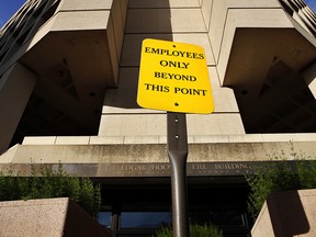 A sign announces "Employees Only Beyond This Point" at an entrance to the J. Edgar Hoover FBI building in Washington, Tuesday, May 9, 2017.