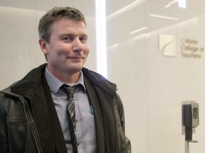 High school teacher Timothy C. Sullivan leaves a disciplinary hearing in Toronto, on February 21, 2017. An Ontario high school science teacher who was found guilty of professional misconduct after pushing anti-vaccination views says he was suspended without pay for three days for speaking to the media about the case.