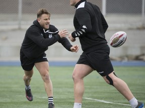 Toronto Wolfpack's Rhys Jacks practices on the field with members of his team during the Toronto Wolfpack rugby team's Press Day at Monarch Stadium in Toronto, Ontario on Thursday, May 4, 2017.