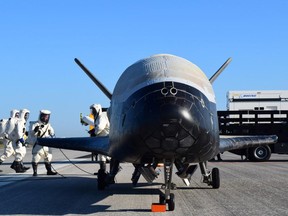 In this image released by the US Air Force, the Air Force's X-37B Orbital Test Vehicle mission 4 lands at NASA's Kennedy Space Center Shuttle Landing Facility in Florida, on May 7, 2017.