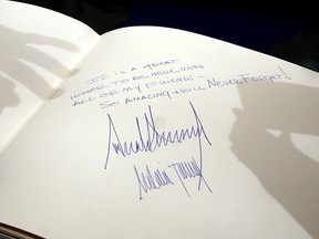 TOPSHOT - The message written by US President Donald Trump at the Yad Vashem Holocaust Memorial Museum guest book and signed by him and his wife Melania is seen after their visit on May 23, 2017, in Jerusalem.