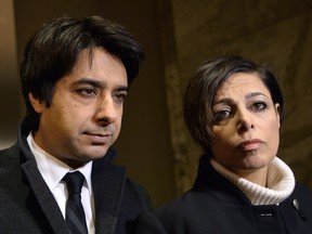 Jian Ghomeshi, left, and his lawyer Marie Henein arrive at court in Toronto on Thursday, Jan. 8, 2015. The choice of Ghomeshi's lawyer as a speaker at four Canadian universities is sparking debate on one Nova Scotia campus.