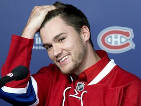 Newly acquired Montreal Canadiens forward Jonathan Drouin smiles during a news conference at the Bell Centre in Montreal on Thursday.