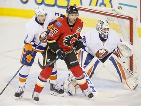 The Calgary Flames acquired former New York Islanders defenceman Travis Hamonic (left) on June 24.