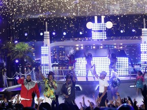 DJ Khaled, from left, Quavo, Lil Wayne, and Chance The Rapper perform "I'm the One" at the BET Awards at the Microsoft Theater on Sunday, June 25, 2017, in Los Angeles. (Photo by Matt Sayles/Invision/AP)