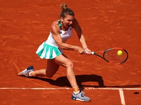 Simona Halep of Romania plays a backhand during her quarter-final match against Elina Svitolina at the 2017 French Open on June 7, 2017.