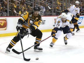 Sidney Crosby controls the puck against Nashville defenceman Mattias Ekholm in the second period of Game 5 of the 2017 NHL Stanley Cup final on June 8, 2017 in Pittsburgh.