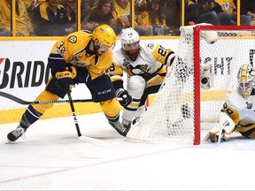 Nashville Predators forward Frederick Gaudreau (left) scores on a wraparound against the Pittsburgh Penguins on June 5.