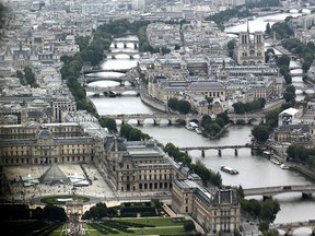 A view of the bridges of the Seine river, the Louvre museum (L) and the Notre-Dame de Paris Cathedral on the Ile de la Cite