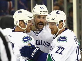The Vancouver Canucks had to protect the Sedin brothers because of their no-trade clauses, but defenceman Erik Gudbranson, centre, also made the list.