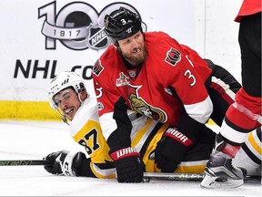 Then-Ottawa Senators defenceman Marc Methot (right) tussles with Pittsburgh Penguins forward Sidney Crosby on May 23.