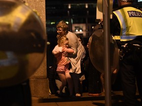 People are lead to safety on Southwark Bridge away from London Bridge after an attack on June 4, 2017