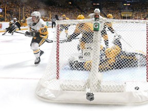 Jake Guentzel of the Pittsburgh Penguins celebrates after scoring a first period goal against Predators netminder Pekka Rinne in Game 3 of the Stanley Cup Final at the Bridgestone Arena in Nashville on Saturday night.