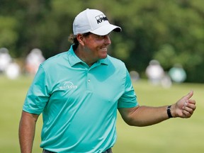 Phil Mickelson reacts to his biridie putt on the 16th hole  during round three of the FedEX St. Jude Classic at the TPC Southwind on June 10, 2017 in Memphis, Tennessee.