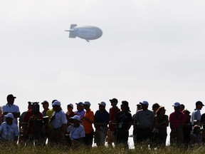 A blimp floats over the crowd during the first round of the 2017 U.S. Open at Erin Hills on June 15, 2017 in Erin, Wisconsin.