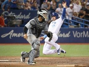 Toronto Blue Jays 1B Justin Smoak scores against the Chicago White Sox on June 17.