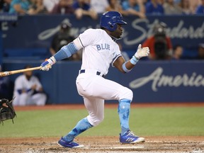 Dwight Smith Jr. of the Toronto Blue Jays hits an RBI single in the seventh inning against the Chicago White Sox at Rogers Centre on June 17, 2017.
